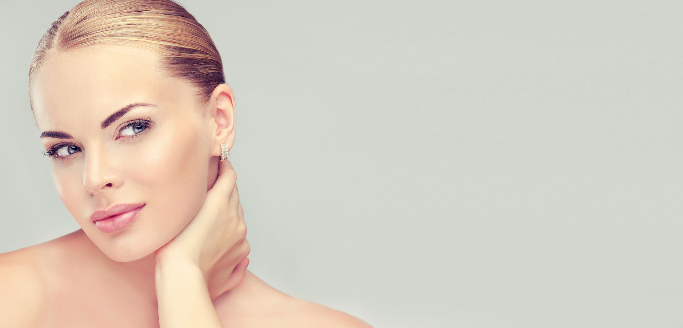 Beautiful Young Woman with Clean Fresh Skin close up . Skin care