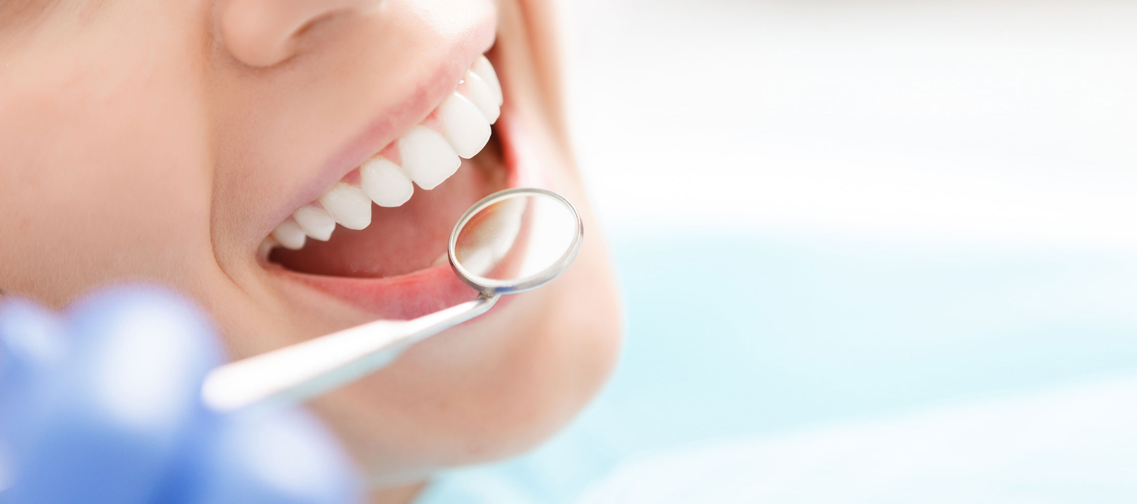 Close-up of woman having her teeth examined